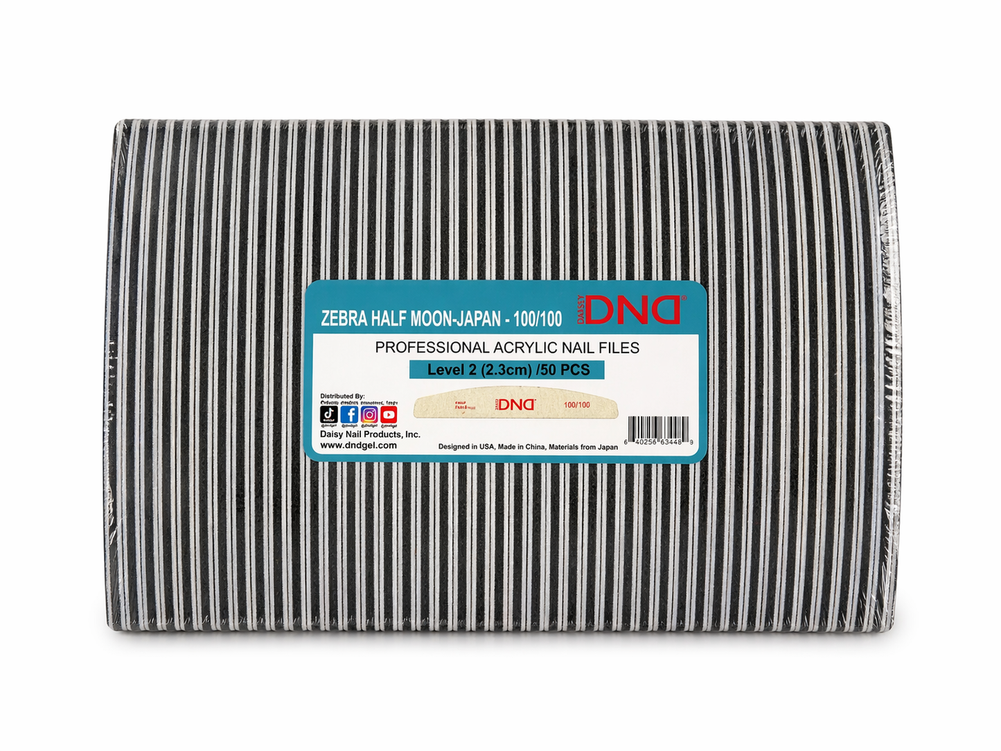 Packaged DND acrylic nail files with a black and white striped design on a white background